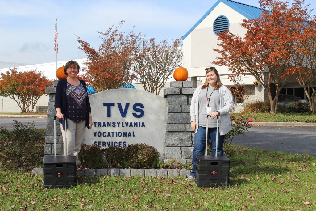 Jess & Montana standing outside TVS sign