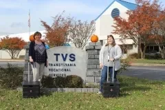 Jess & Montana standing outside sign